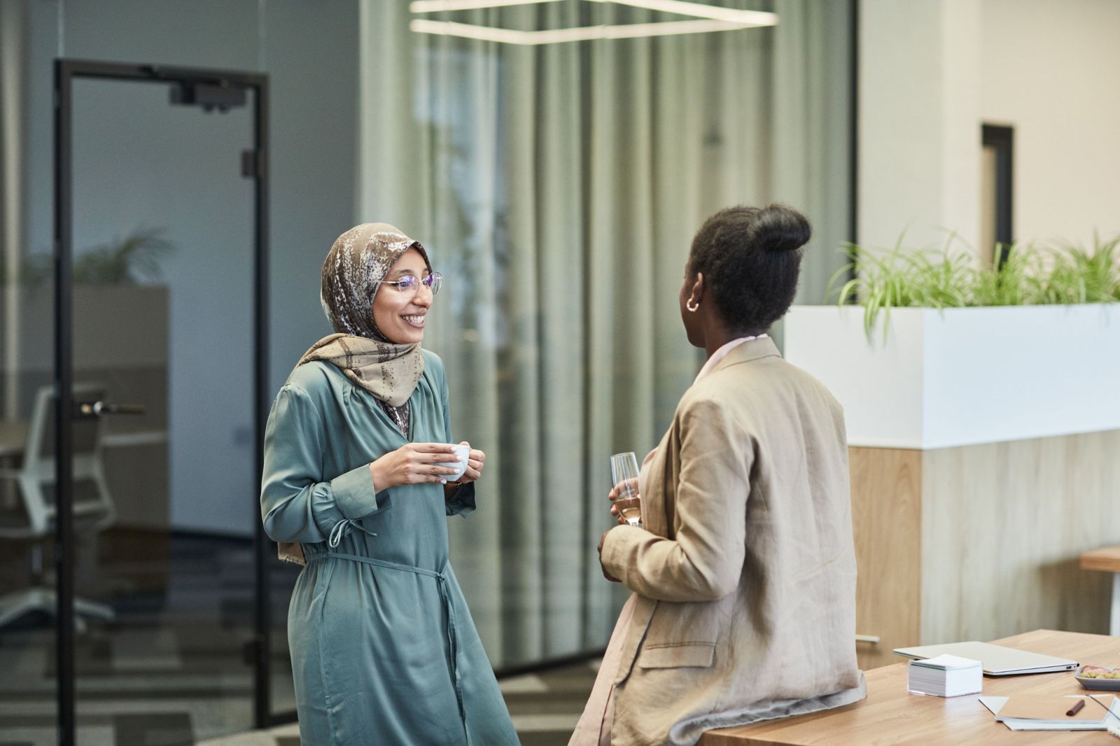 Two women talking over coffee