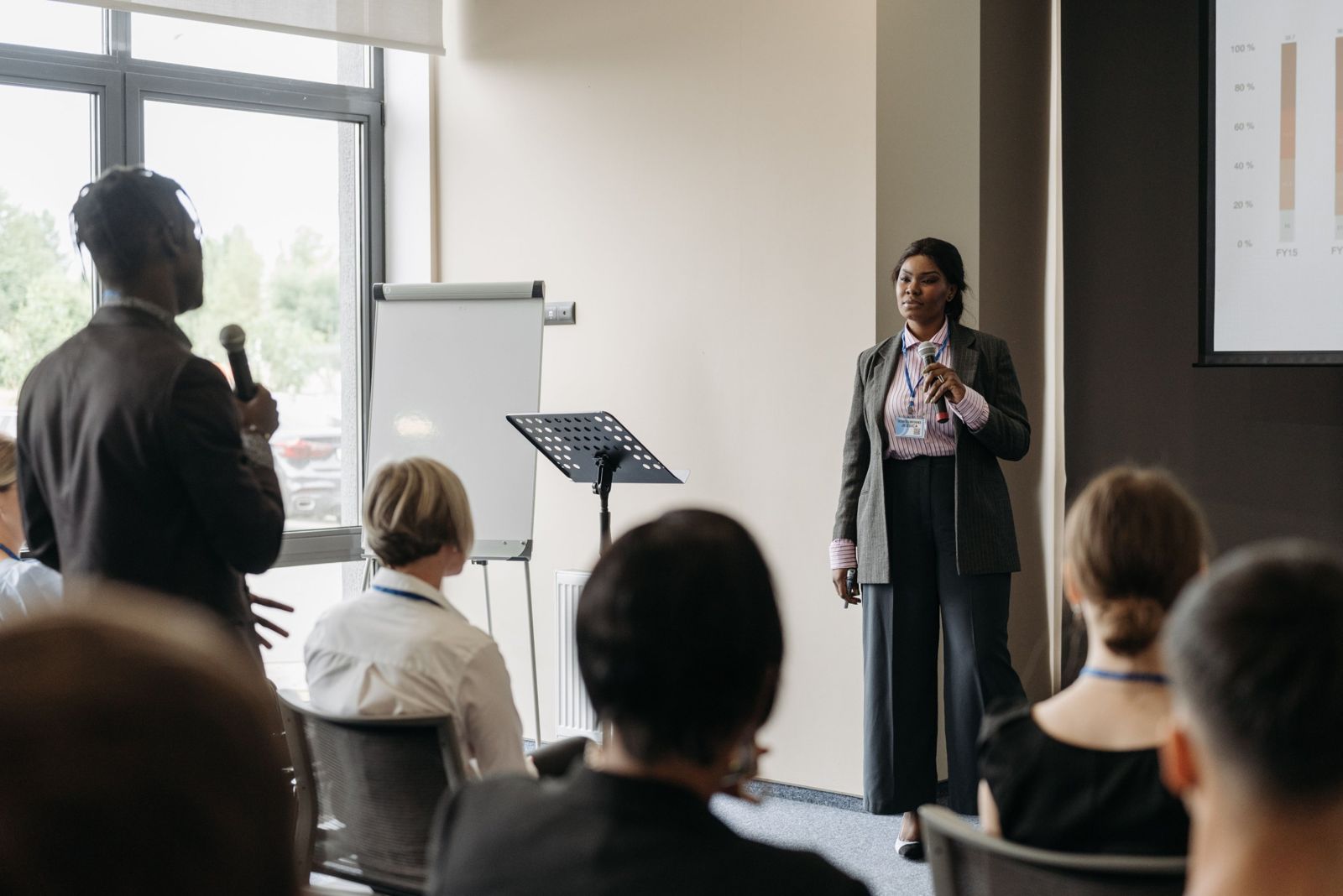 A woman presenting to a room