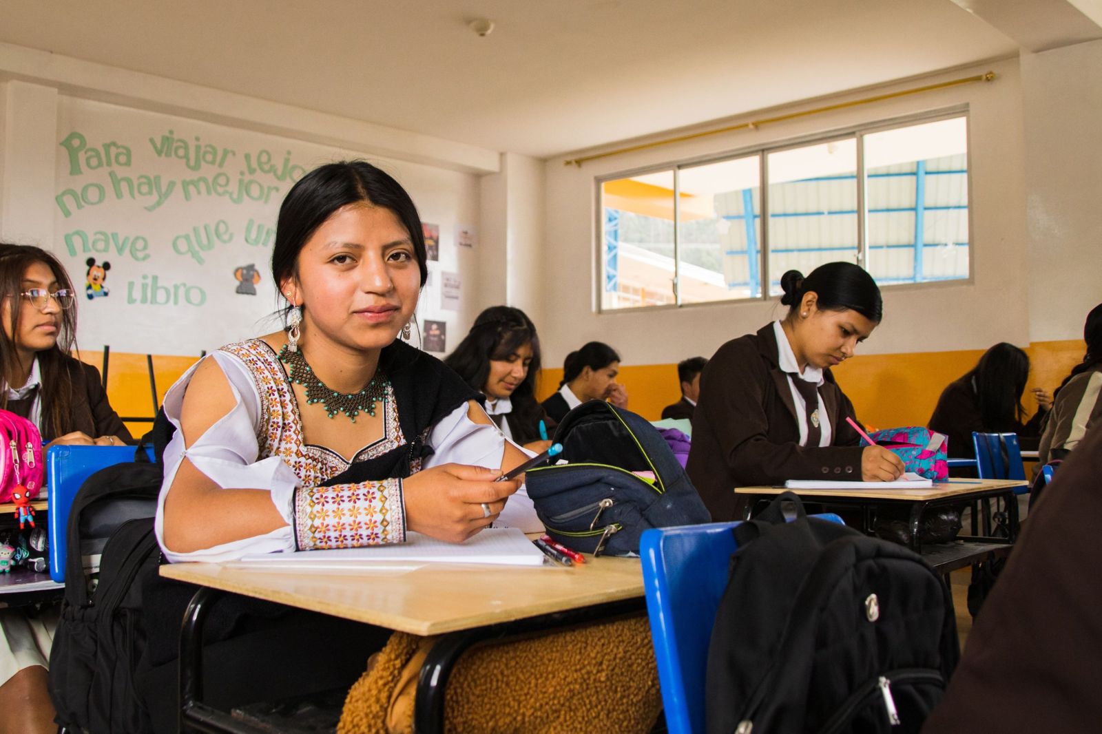 A student at her desk in a classroom