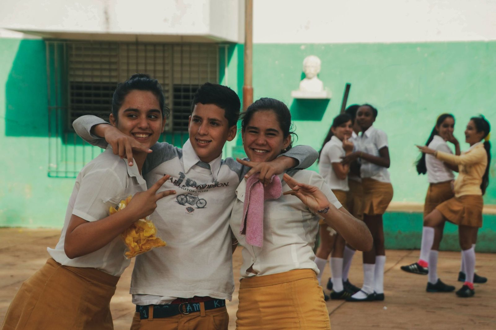 Students laughing together in a school courtyard